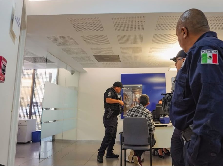 Officers assisting a visitor inside a field office
