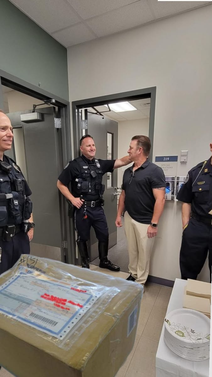 Officers greeting a visitor at the front desk